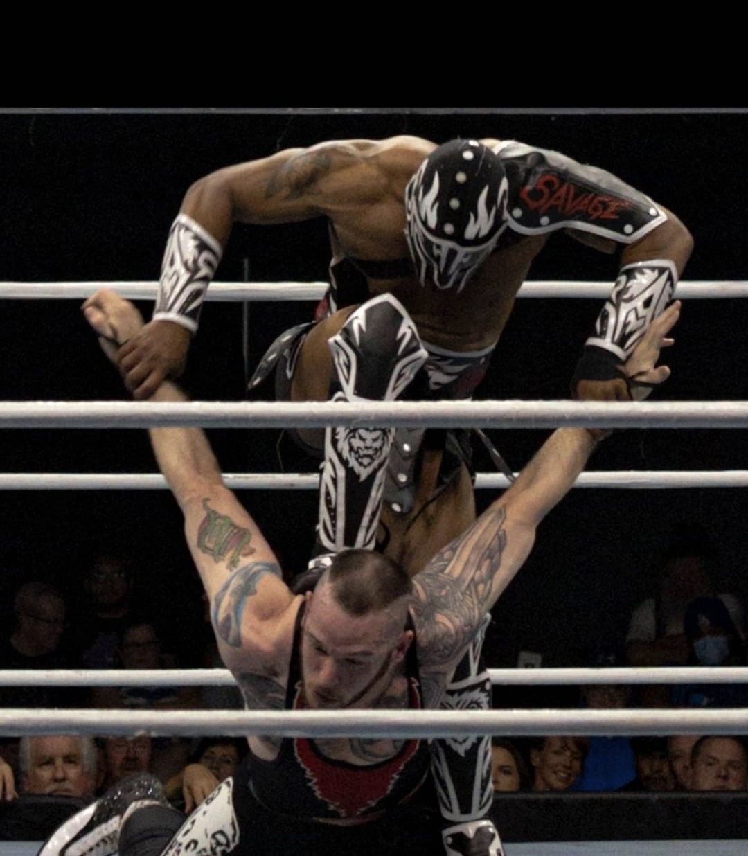 The Savage King mid-air in the ring